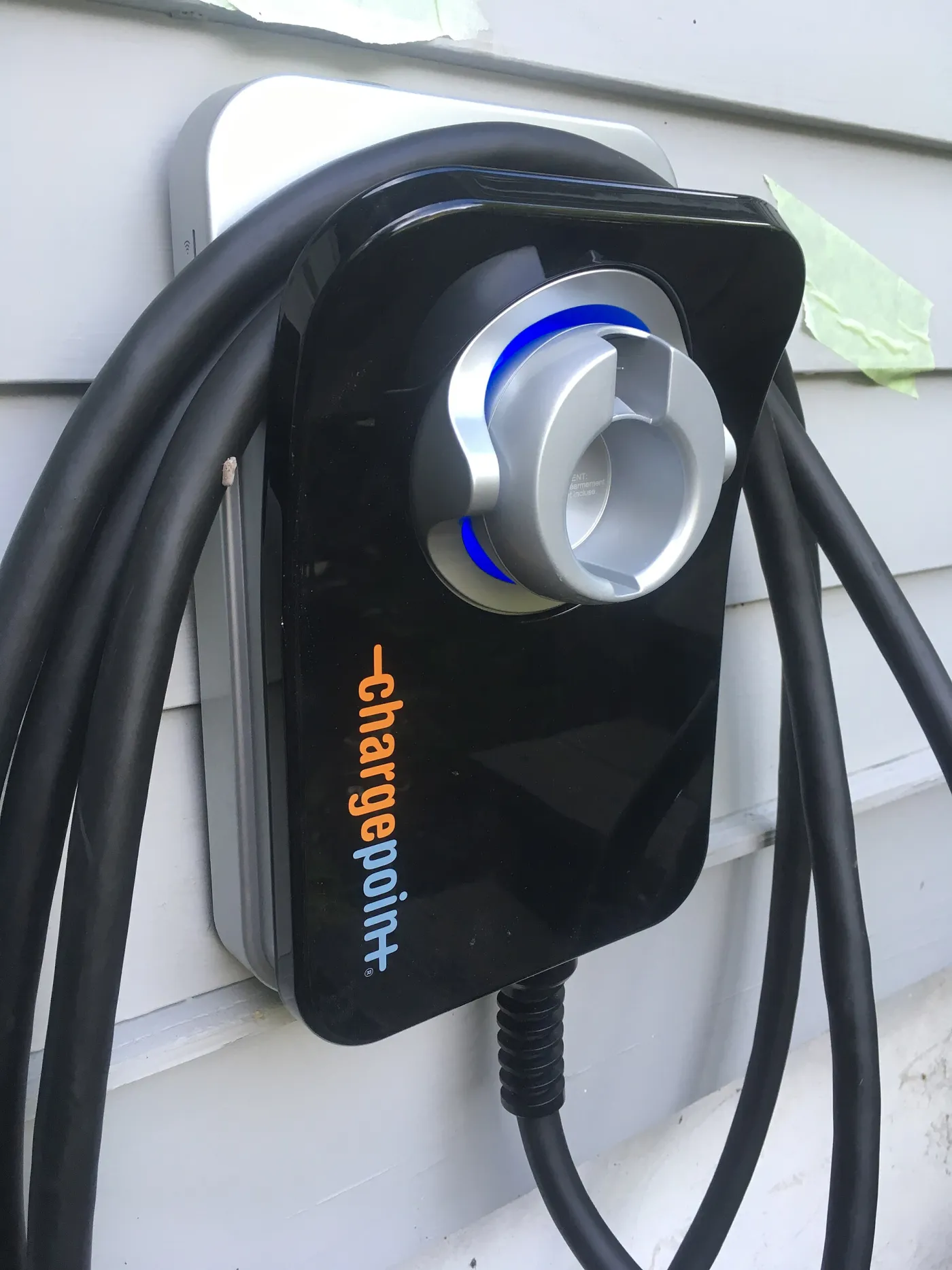 A wall-mounted AC home charger, the 7.4 kW class